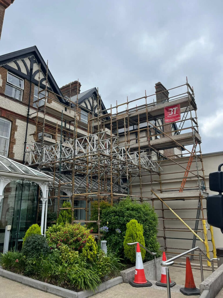 Cantilever Scaffolding Protects Glass Sunroom During Plastering